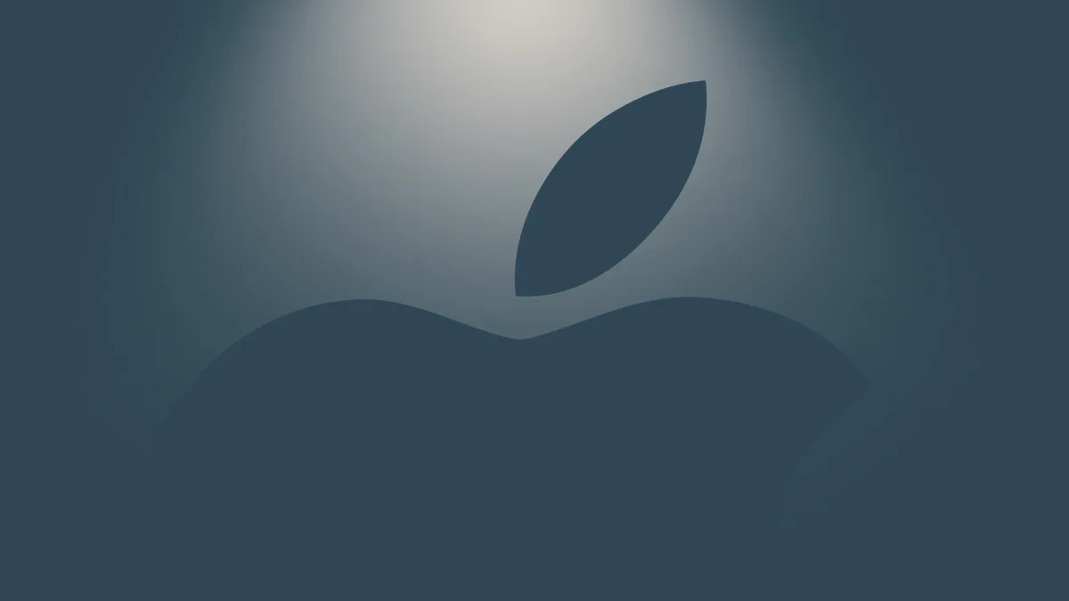 Apple logo with blue spotlight representing new default apps
