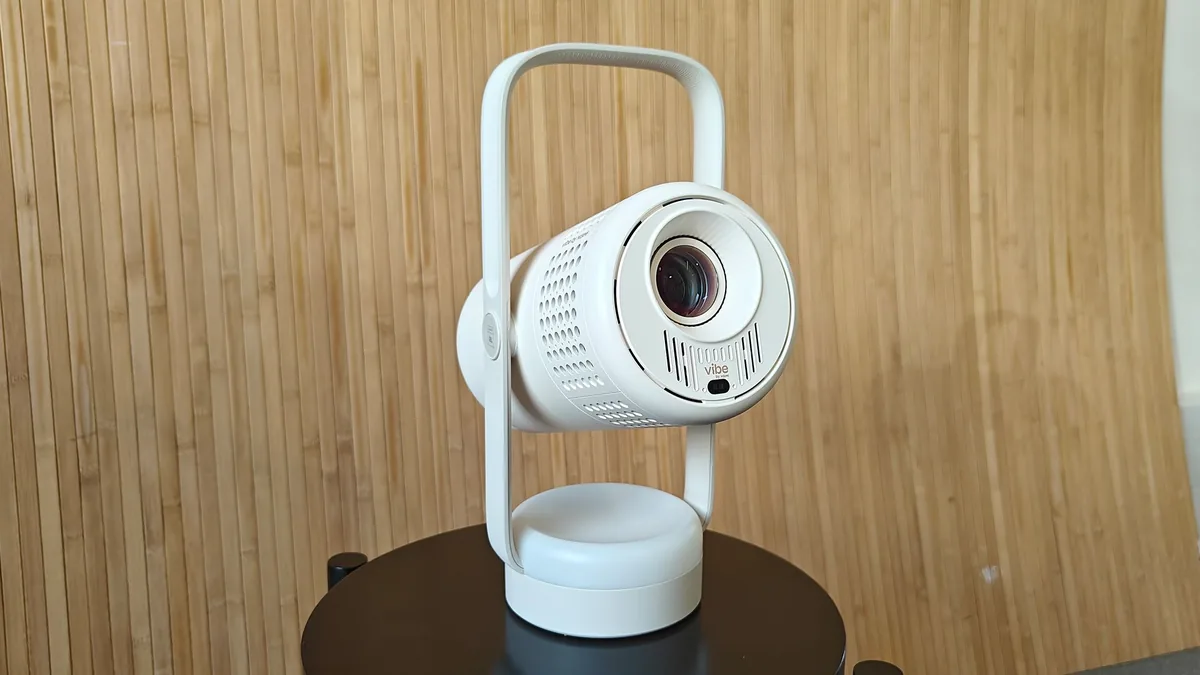 Editorial WebP cover showing a compact portable projector gadget