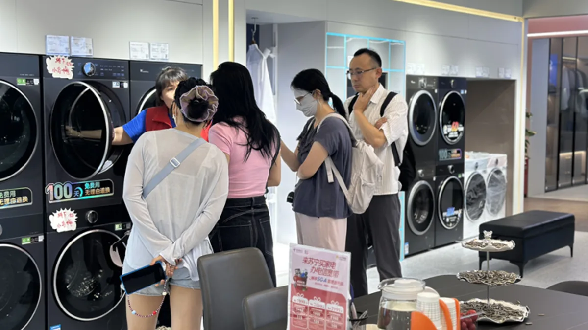 Smart home appliance retail display representing AI service features in everyday gadgets