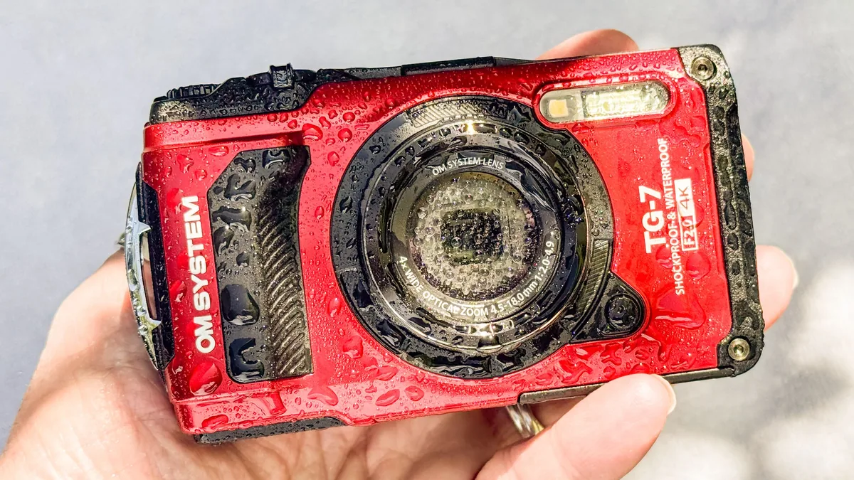 Editorial WebP cover showing a rugged waterproof compact camera