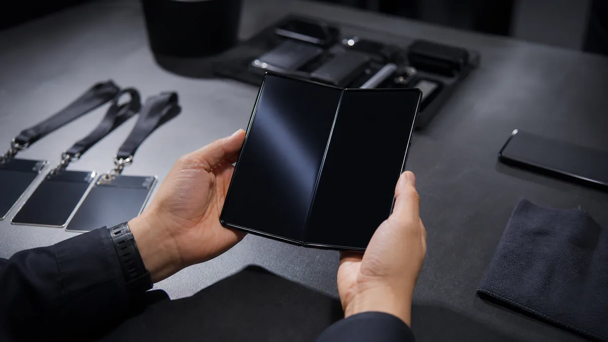 Generated editorial image of a wide unbranded foldable phone before a launch event