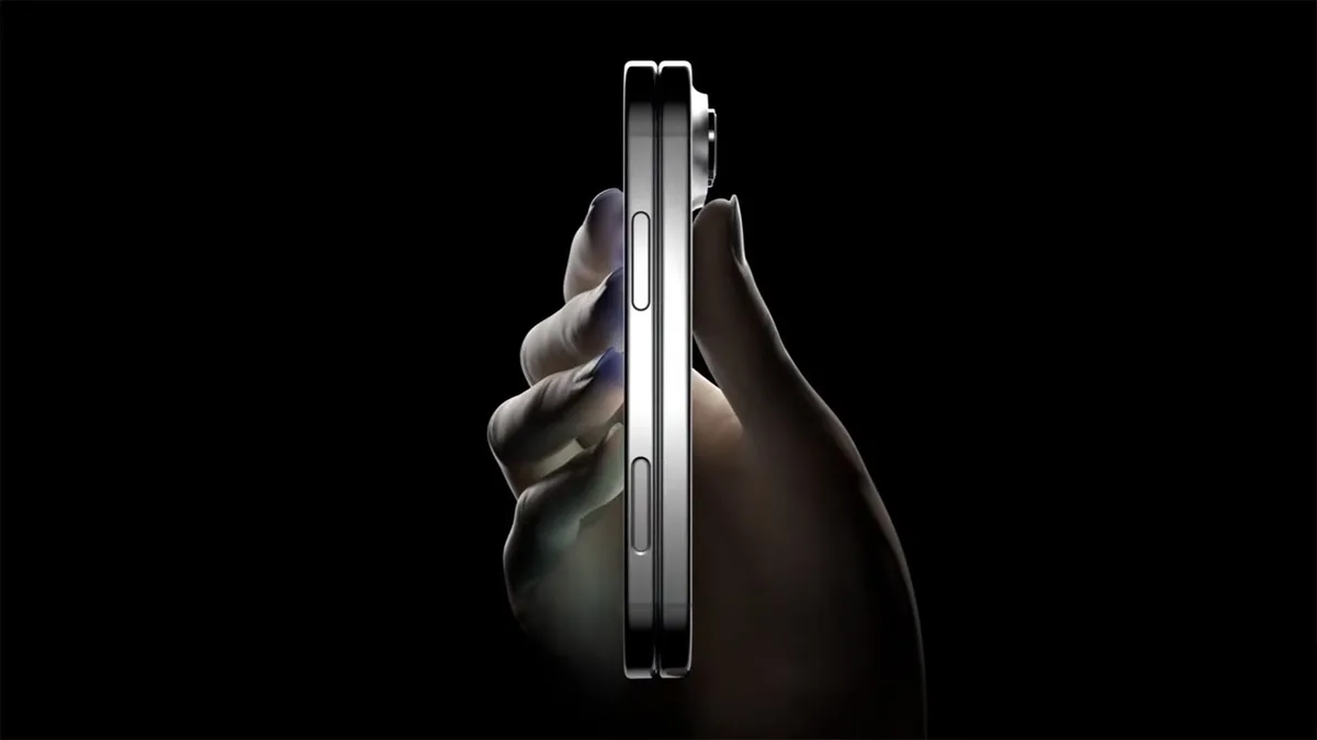 Foldable phone concept on a desk beside supply chain notes